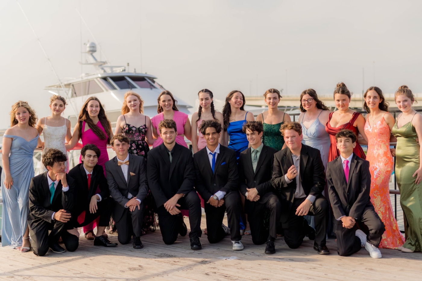 The full prom group along the marina